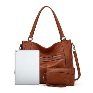 Brown faux leather tote bag and clutch set shown with a tablet for scale comparison