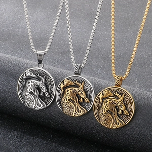 Nordic wolf pendant necklaces in silver, gold, and bronze finishes on black background