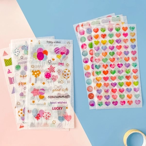 Colorful washi paper stickers set featuring hearts and balloons on a split pastel background