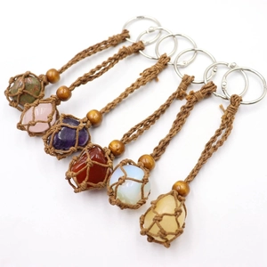 Macro view of six handcrafted woven net keychains featuring various natural raw crystals