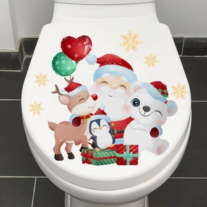 Close-up of Santa and Reindeer adhesive Christmas toilet lid stickers on white ceramic