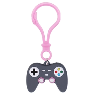 Detail of dark grey silicone gamepad keychain with pink clasp and classic buttons