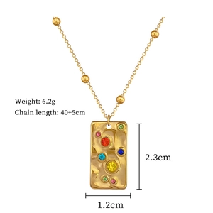 Detail of gold titanium rectangular necklace with colorful stones and product dimensions