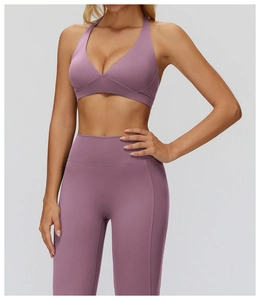 Detailed side view of lavender yoga sports bra and high-waist leggings on model