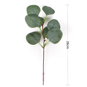 Detailed view of artificial eucalyptus branch with green leaves and 26cm height scale