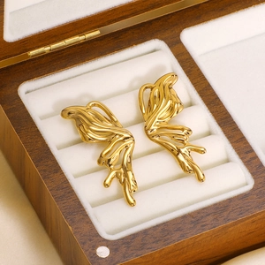 3D liquid metal butterfly earrings in gold finish presented in a premium wooden jewelry box