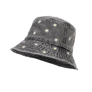 Dark gray denim bucket hat with white daisy floral embroidery and classic wide brim design