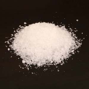 Artificial white snow powder for Christmas scene decoration on a sleek black background