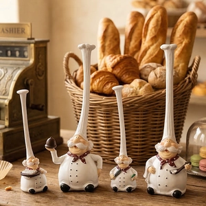 Set of four resin chef figurines with long hats in a rustic bakery kitchen setting
