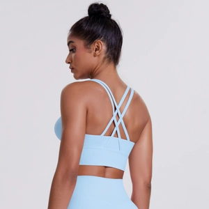 Close-up of the sky blue sports bra featuring cross-back straps and soft brushed fabric