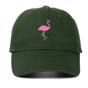 Detailed embroidery of a pink flamingo on a dark green cotton twill baseball cap
