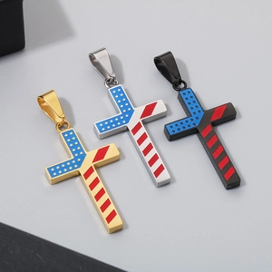 Detailed view of gold, silver and black titanium cross pendants with US flag star patterns