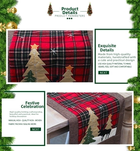 Detail view of red and black plaid Christmas table runner with reindeer embroidery