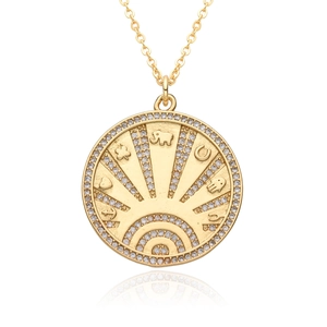 Detailed view of a gold sunburst pendant with micro-set zircon and lucky symbols