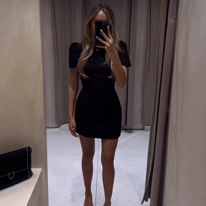 Chic black bodycon puff sleeve mini dress with a slim fit silhouette for women