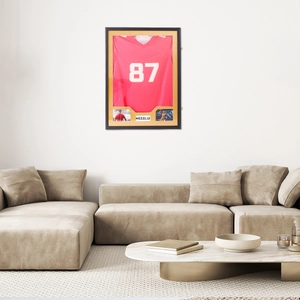 Jersey display frame on wall with gold matting and soccer athlete photo plaques