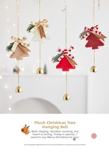 Detail view of plush Christmas tree hanging ornaments with golden bells and merry tags