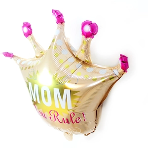 Detail of crown shaped gold foil balloon with pink accents and Mom You Rule text