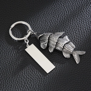 Detailed close-up of a silver fishbone keychain with a polished rectangular pendant