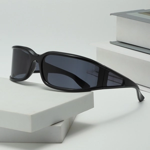 Y2K punk wraparound sunglasses with black frames and lenses on geometric blocks