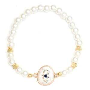 Close-up of pearl bead bracelet featuring golden stars and blue evil eye charm detail