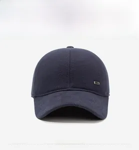 Close-up of deep blue wool blend baseball cap with a subtle metal plaque detail