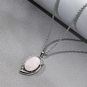 Elegant silver rope chain necklace with an oval white gemstone and rhinestone accents
