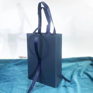 Vertical navy blue textured gift bag with grosgrain handles, height 190mm and width 128mm