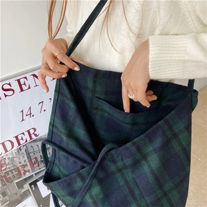 Close-up of interior pocket and plaid wool texture of a large tote bag