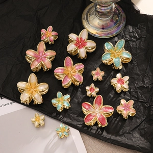 Detailed comparison of various sizes and colors of enamel frangipani flower hair clips