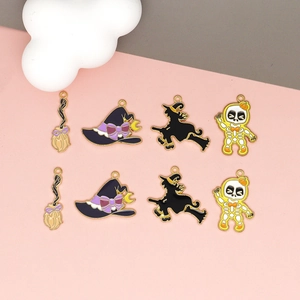 Set of 8 Halloween enamel charms featuring witch hats, skulls, and brooms with gold edges