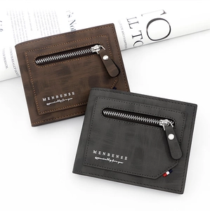 Detail of brown and grey frosted leather wallets with metal zipper and brand logo