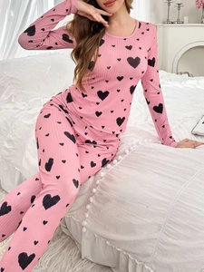 Detail of pink ribbed knit heart print pajama set with long sleeves and pants