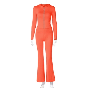 Front view of orange zip-up hoodie and flared pants two-piece set on a mannequin