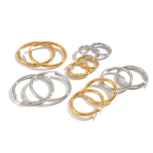 Minimalist stainless steel hoop earrings in gold and silver finish, multiple sizes
