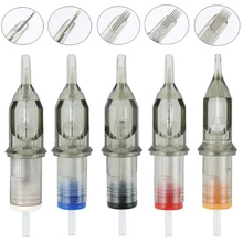 Macro detail of various tattoo needle cartridges with colored rings for needle sizing