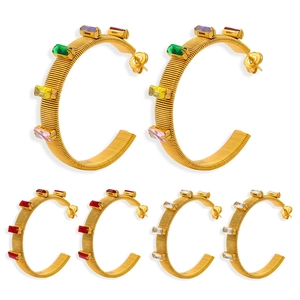 Textured gold C-hoop earrings with colorful baguette-cut stones in three distinct colorways