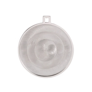 Macro detail of silver stainless steel round pendant with concentric texture and ring