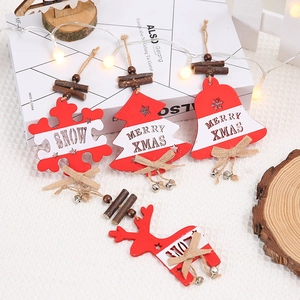 Red and white wooden Christmas ornaments set with snowflakes and bells for tree decor