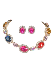 Macro view of bridal jewelry set with colorful rhinestones and gold-plated base