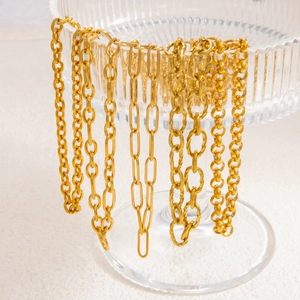Collier en acier inoxydable plaqué or 18k avec fermoir à ressort et divers maillons