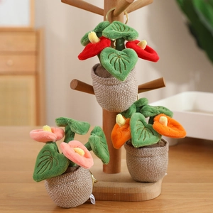 Creative plush anthurium plant keychain in red, pink, and orange with gold metal ring
