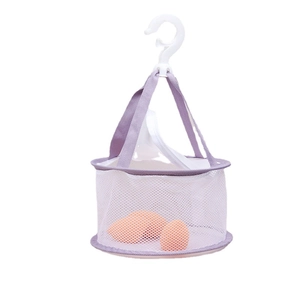 Purple hanging mesh drying basket for makeup sponges with white plastic hook on white background