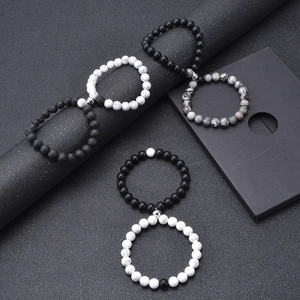 Magnetic attraction bracelets for couples featuring matte black stone and white turquoise