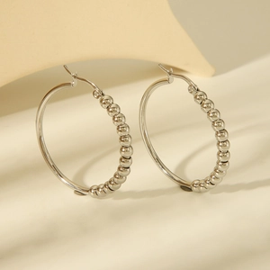 Polished titanium steel hoop earrings featuring minimalist silver beads for women