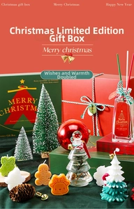 Detail view of a Christmas scented candle gift box with gingerbread and reindeer shapes