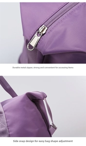 Detail of purple travel bag featuring durable metal zippers and side snap buttons