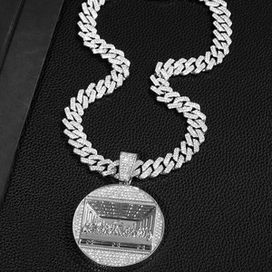 Iced out hip hop necklace featuring a Last Supper round pendant and Cuban link chain
