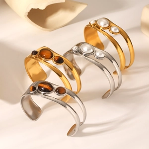 Hollow stainless steel open bracelets with tiger eye stones and pearls in gold and silver