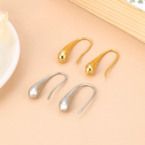 Minimalist stainless steel teardrop earrings in gold and silver finish shown in a set